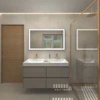 Modern bathroom featuring a double vanity with illuminated mirror brass accents glass shower enclosure and minimalist design with neutral tones Castle Bathroom Tile Centre Modern bathroom featuring a double vanity with illuminated mirror brass accents glass shower enclosure and minimalist design with neutral tones