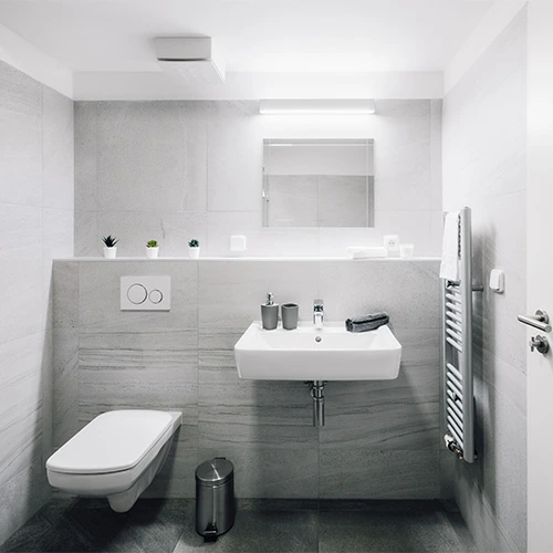 Minimalist spacesaving bathroom solution with wallmounted toilet and sink featuring sleek storage and a clean modern look Castle Bathroom Tile Centre Minimalist space saving bathroom solution with wall mounted toilet and sink featuring sleek storage and a clean modern look