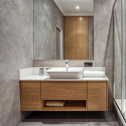 Sleek spacesaving small bathroom layout featuring a wallmounted wooden vanity with a modern sink maximizing storage and style in a compact space Castle Bathroom Tile Centre Sleek space saving small bathroom layout featuring a wall mounted wooden vanity with a modern sink maximizing storage and style in a compact space